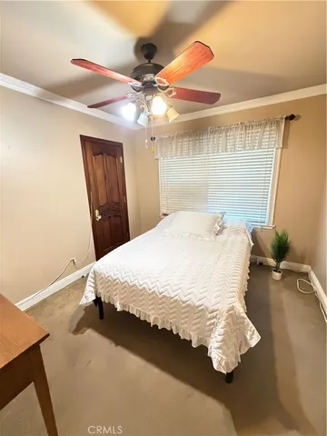 a bathroom with a granite countertop sink a large mirror and shower