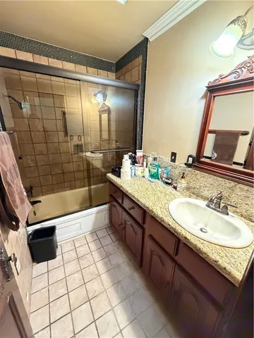 a kitchen with granite countertop a stove and a refrigerator