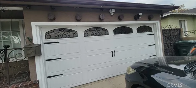 a hallway with couches a flat screen tv and a stove top oven