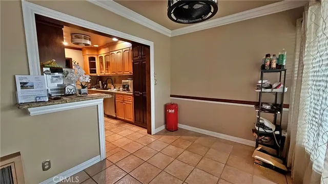 a bedroom with a bed and a ceiling fan