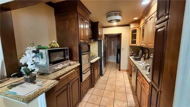 a bed room with a bed and a chandelier