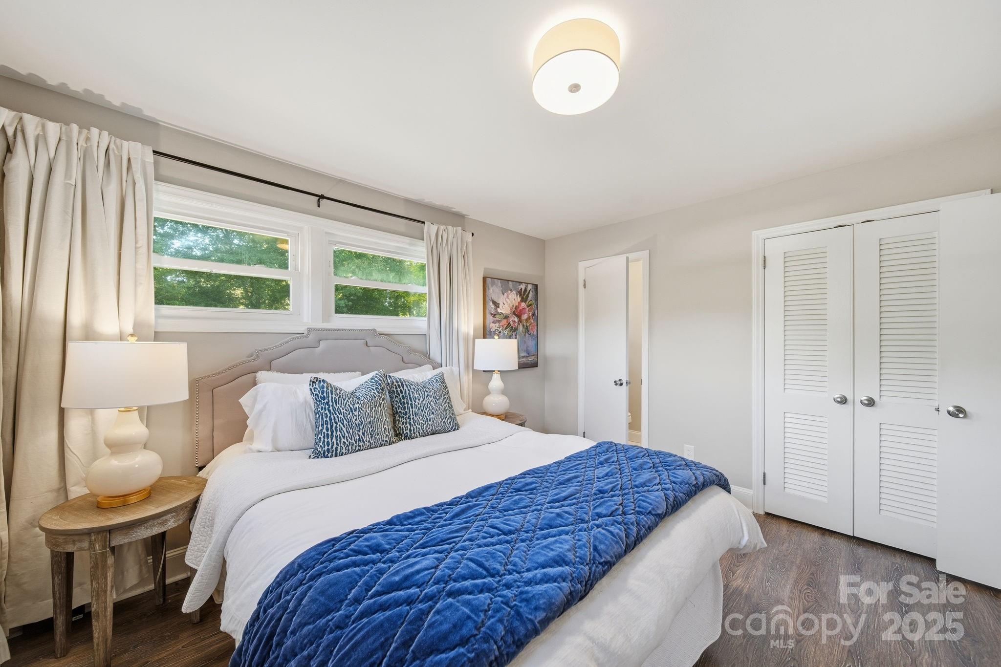 5631 Londonderry Road Charlotte, NC 28210 - Photo 17 of 32 a bedroom with a large bed and a window