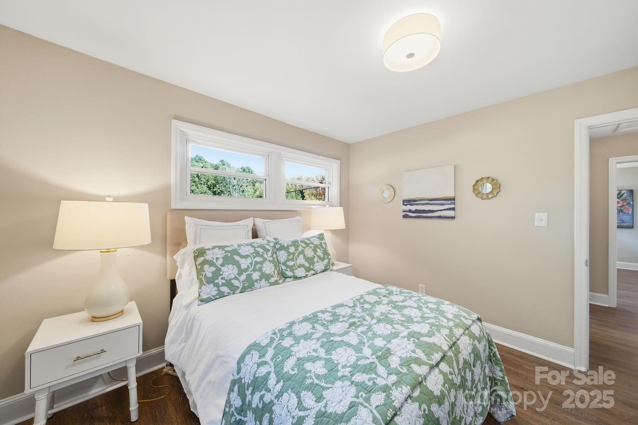 5631 Londonderry Road Charlotte, NC 28210 - Photo 20 of 32 a bedroom with a large bed and a window