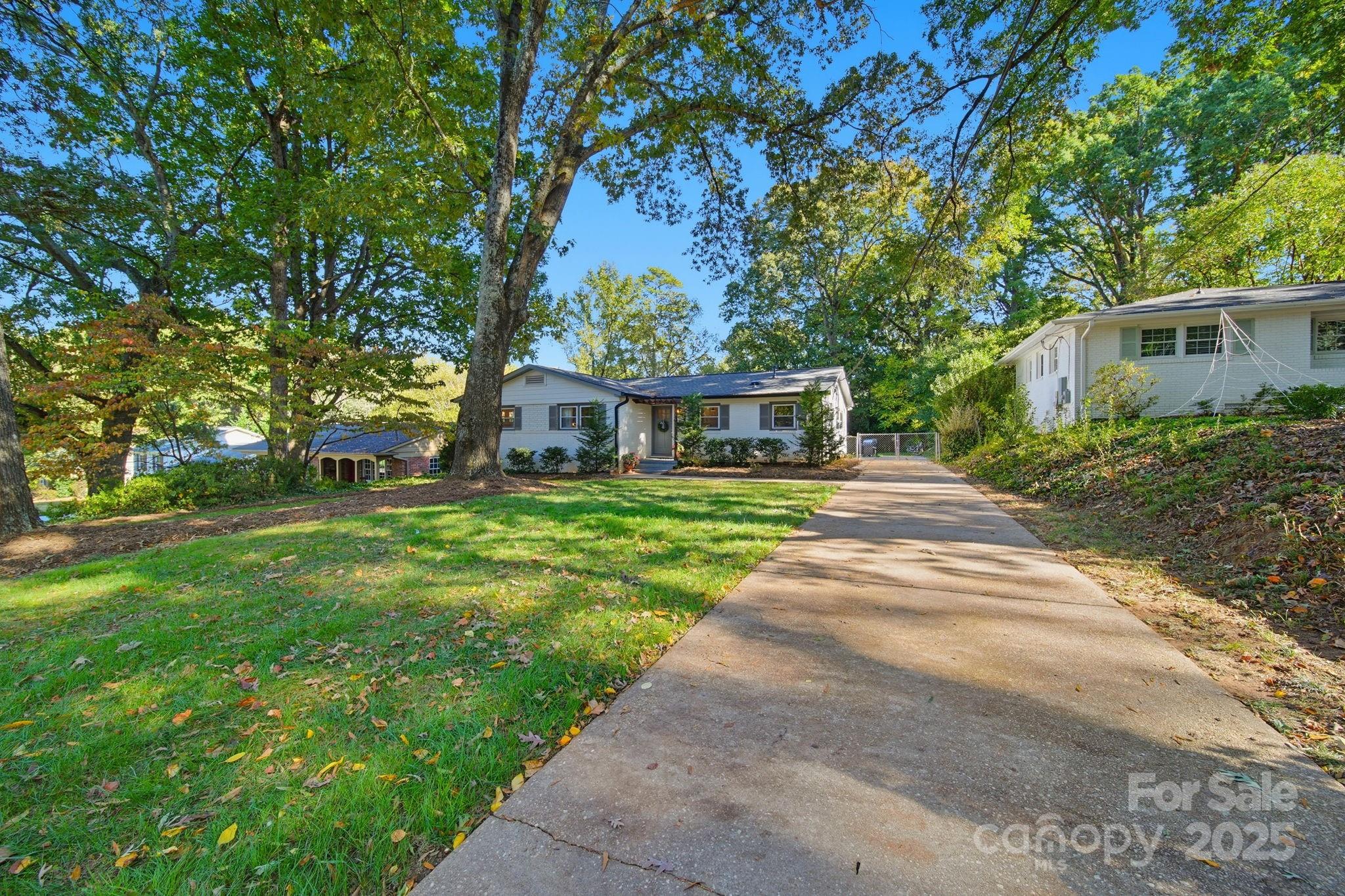 5631 Londonderry Road Charlotte, NC 28210 - Photo 2 of 32 a front view of a house with garden