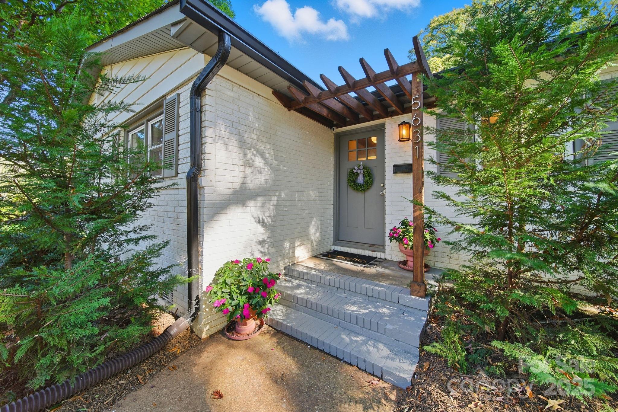 5631 Londonderry Road Charlotte, NC 28210 - Photo 3 of 32 a front view of a house with a yard