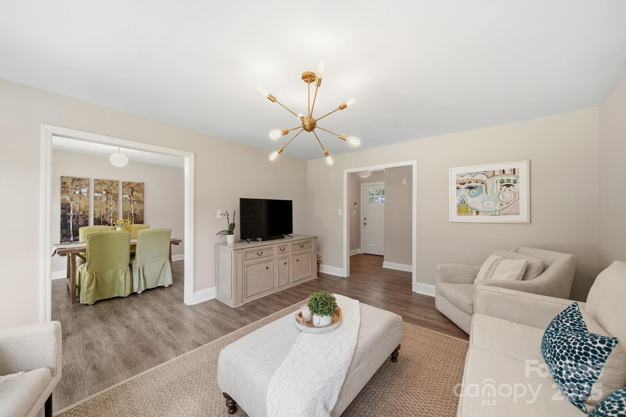 5631 Londonderry Road Charlotte, NC 28210 - Photo 7 of 32 a living room with furniture and a flat screen tv