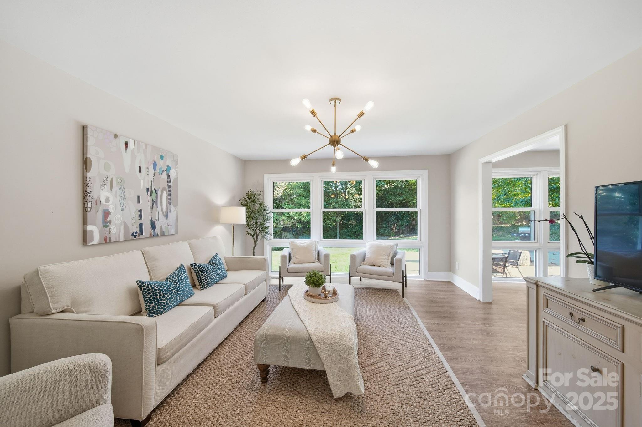 5631 Londonderry Road Charlotte, NC 28210 - Photo 8 of 32 a living room with furniture large window and flat screen tv