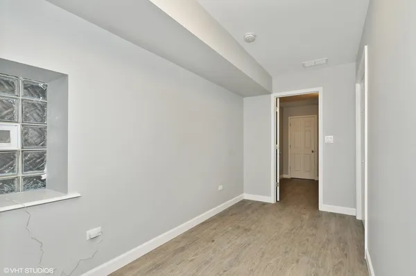 a view of an empty room with a window