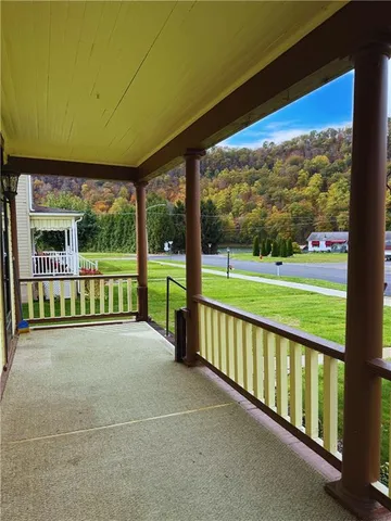 a view of a garden with an outdoor seating space