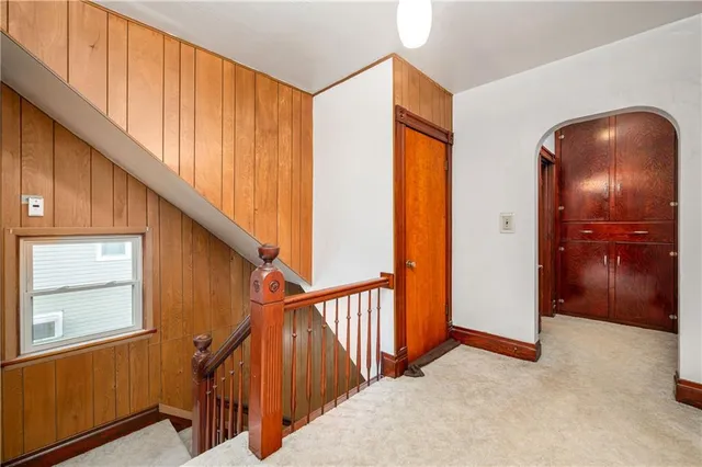 a view of hallway with windows