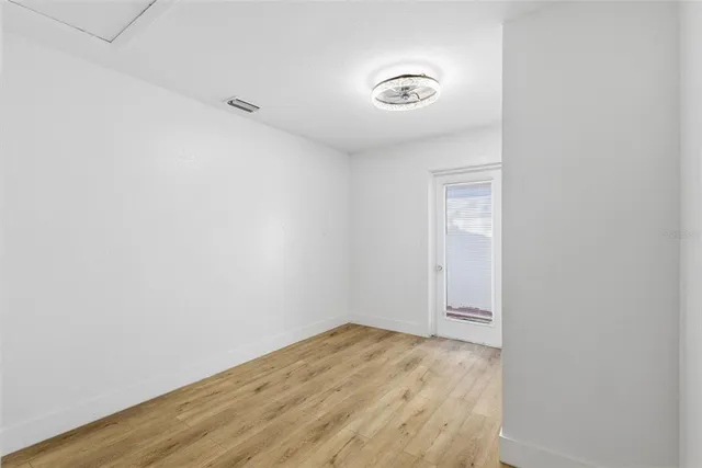 a view of a backyard with a large tree