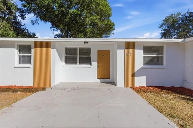 a view of a house with a yard