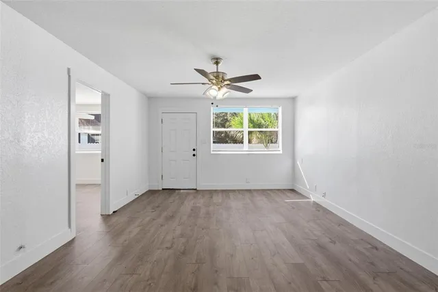 a kitchen with granite countertop a sink and cabinets