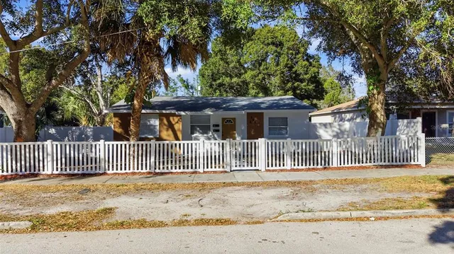 an aerial view of a house with a yard and garden view