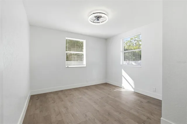 an aerial view of residential house with outdoor space and trees
