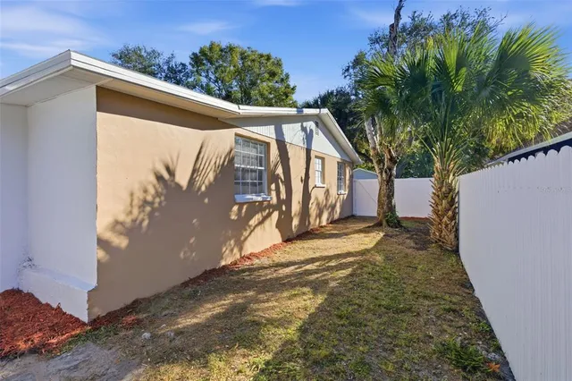 a view of a house with a tree