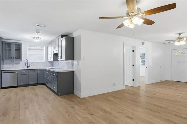 a kitchen with a sink and cabinets