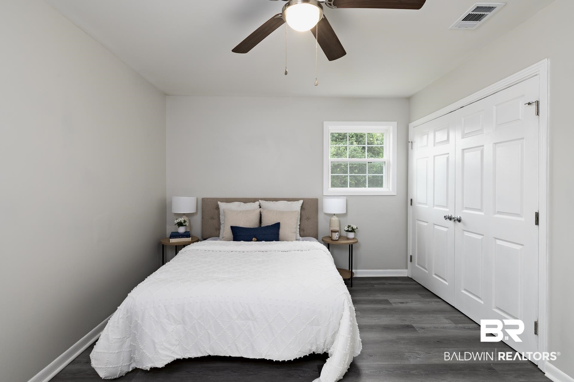 5922 Sunnyside Drive Mobile, AL 36619 - Photo 34 of 51 Bedroom with a closet, dark wood-style flooring, baseboards, and ceiling fan