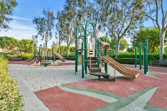 a park view with a bench next to a yard