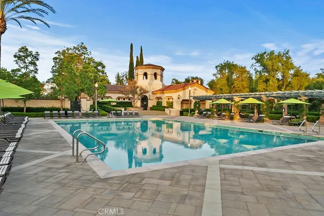 a view of swimming pool with outdoor seating
