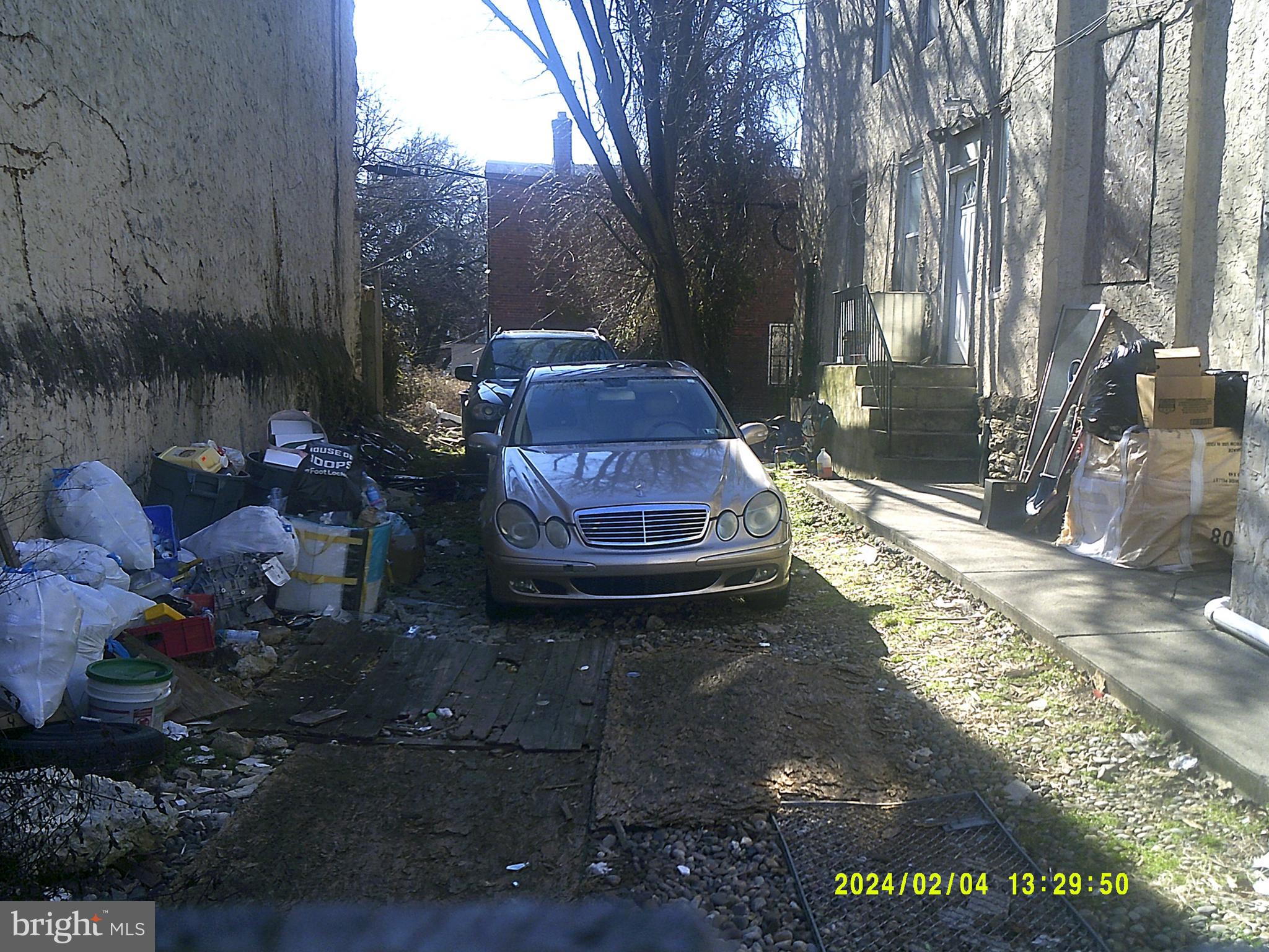 2012 East Chelten Avenue Philadelphia, PA 19138 - Photo 3 of 4 a view of a backyard with table and chairs with wooden fence