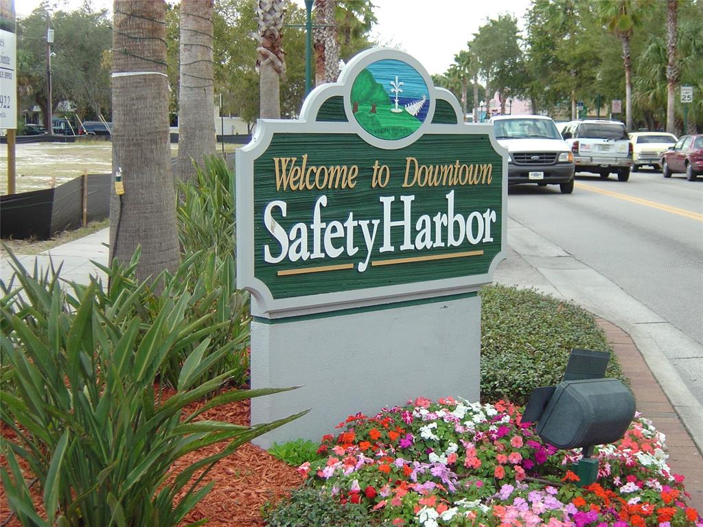 603 Baldwin Avenue, Unit B Safety Harbor, FL 34695 - Photo 27 of 32 a sign that is on a street
