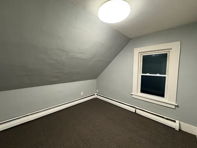 an empty room with a empty space and window