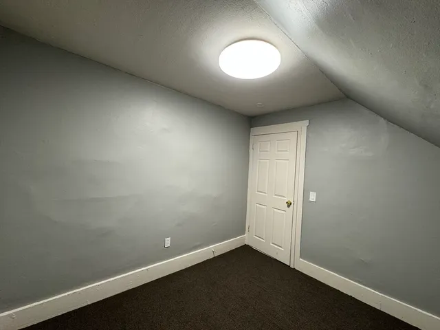 an empty room with a empty space and window