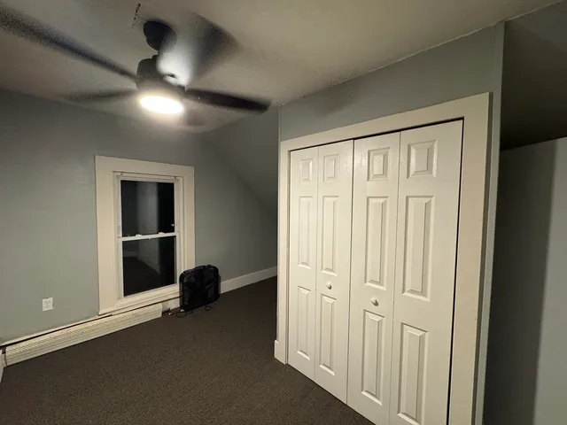 an entryway at a hall with wooden floor