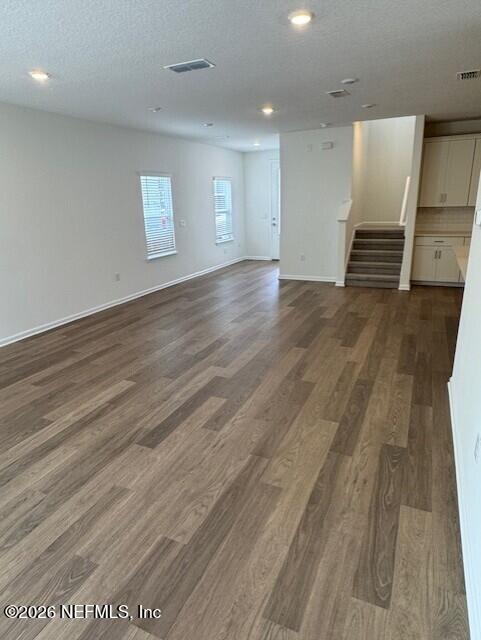 140 Chestnut Grv Road St. Augustine, FL 32092 - Photo 11 of 17 an empty room with wooden floor and windows