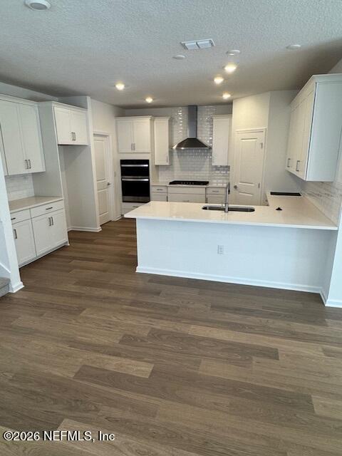 140 Chestnut Grv Road St. Augustine, FL 32092 - Photo 2 of 17 a large kitchen with stainless steel appliances a large counter top and a stove top oven