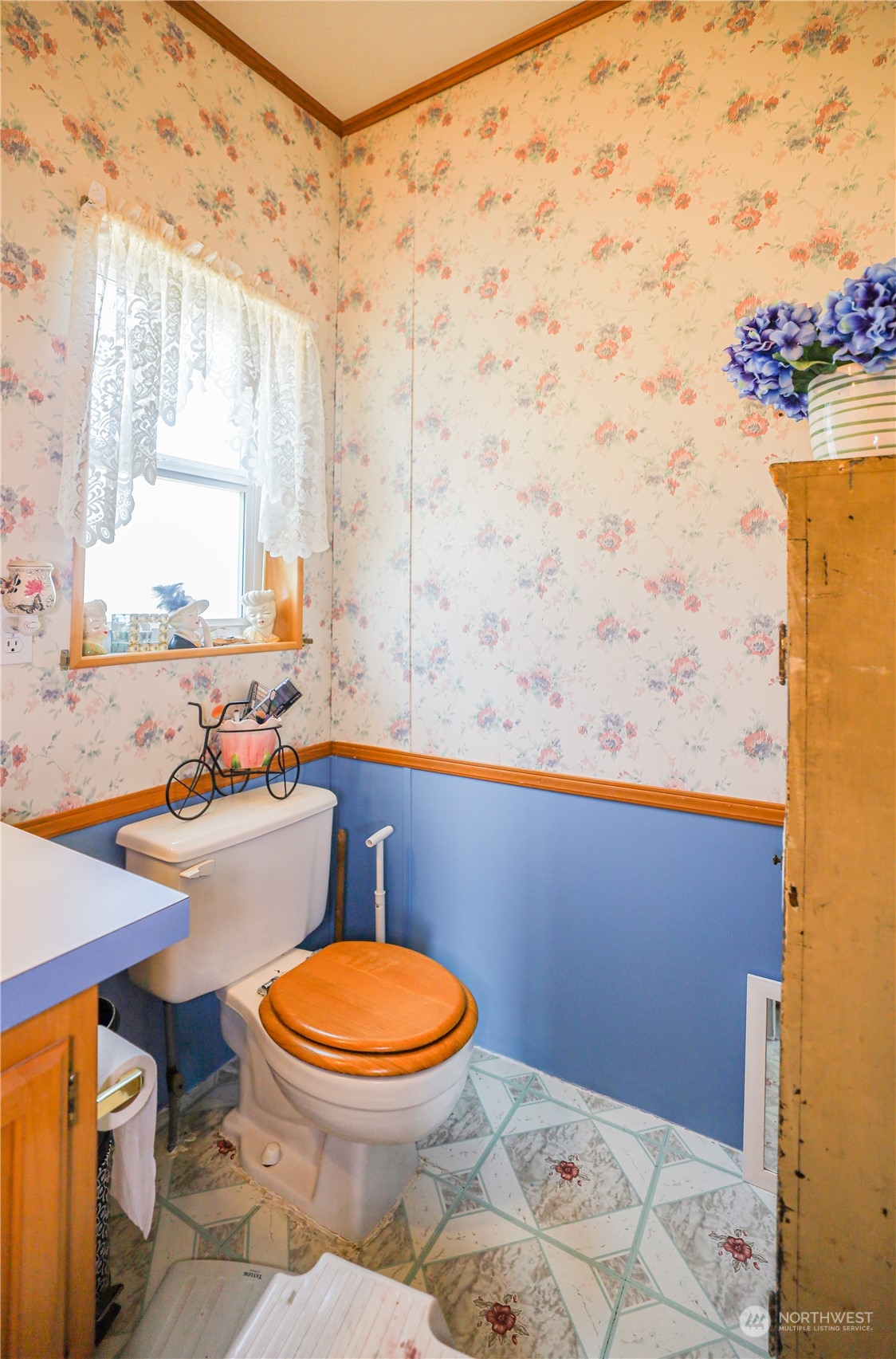9 Poplar Road, Unit 33 Montesano, WA 98563 - Photo 14 of 18 a bathroom with a sink mirror vanity and toilet