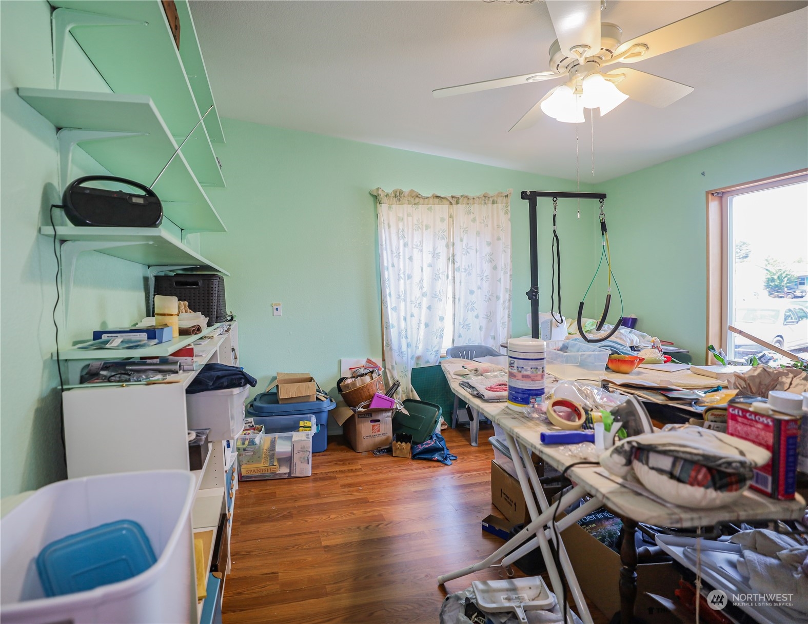 9 Poplar Road, Unit 33 Montesano, WA 98563 - Photo 17 of 18 a room with furniture a chandelier and a window
