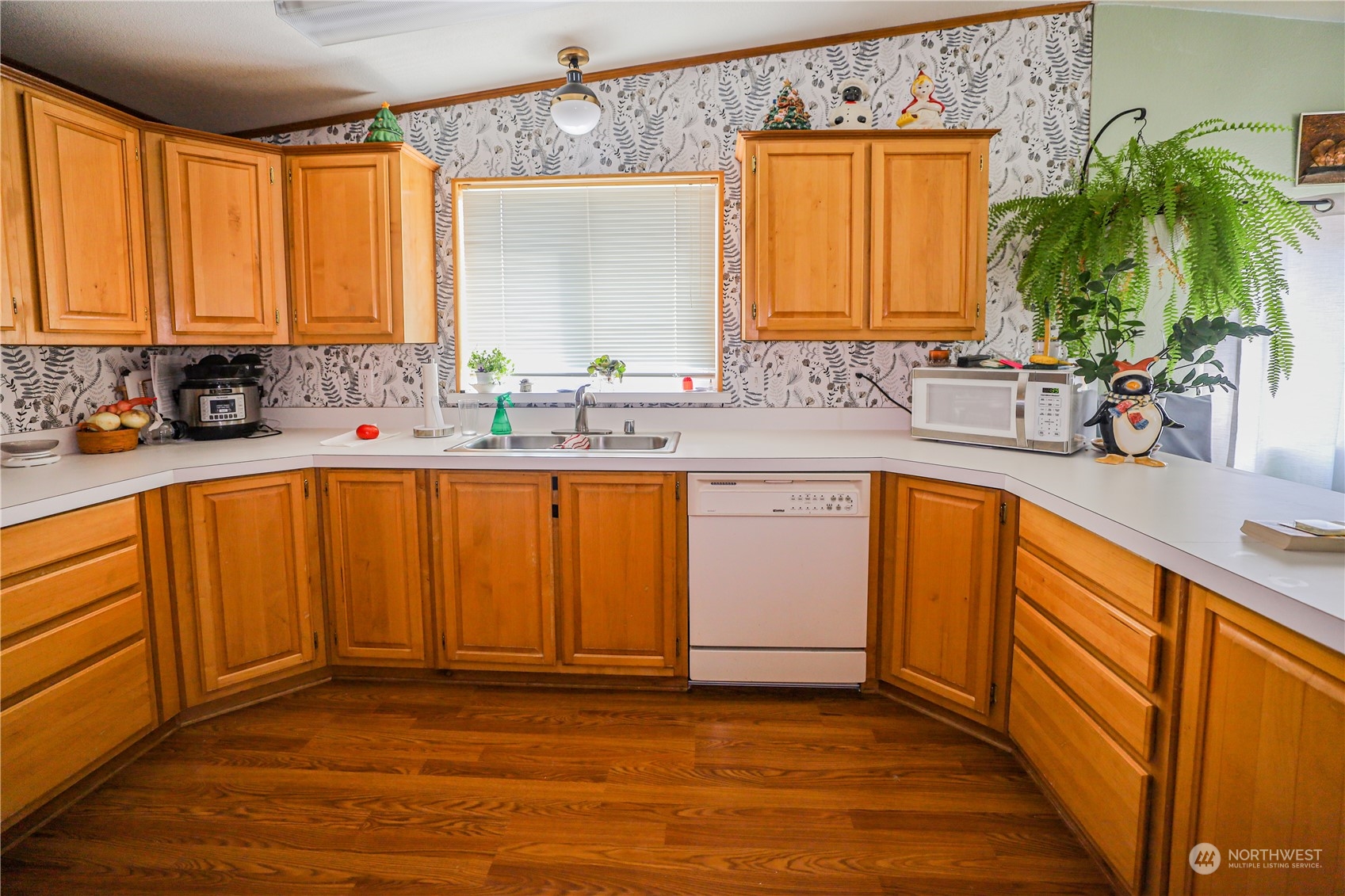 9 Poplar Road, Unit 33 Montesano, WA 98563 - Photo 6 of 18 a kitchen with a sink a window and cabinets