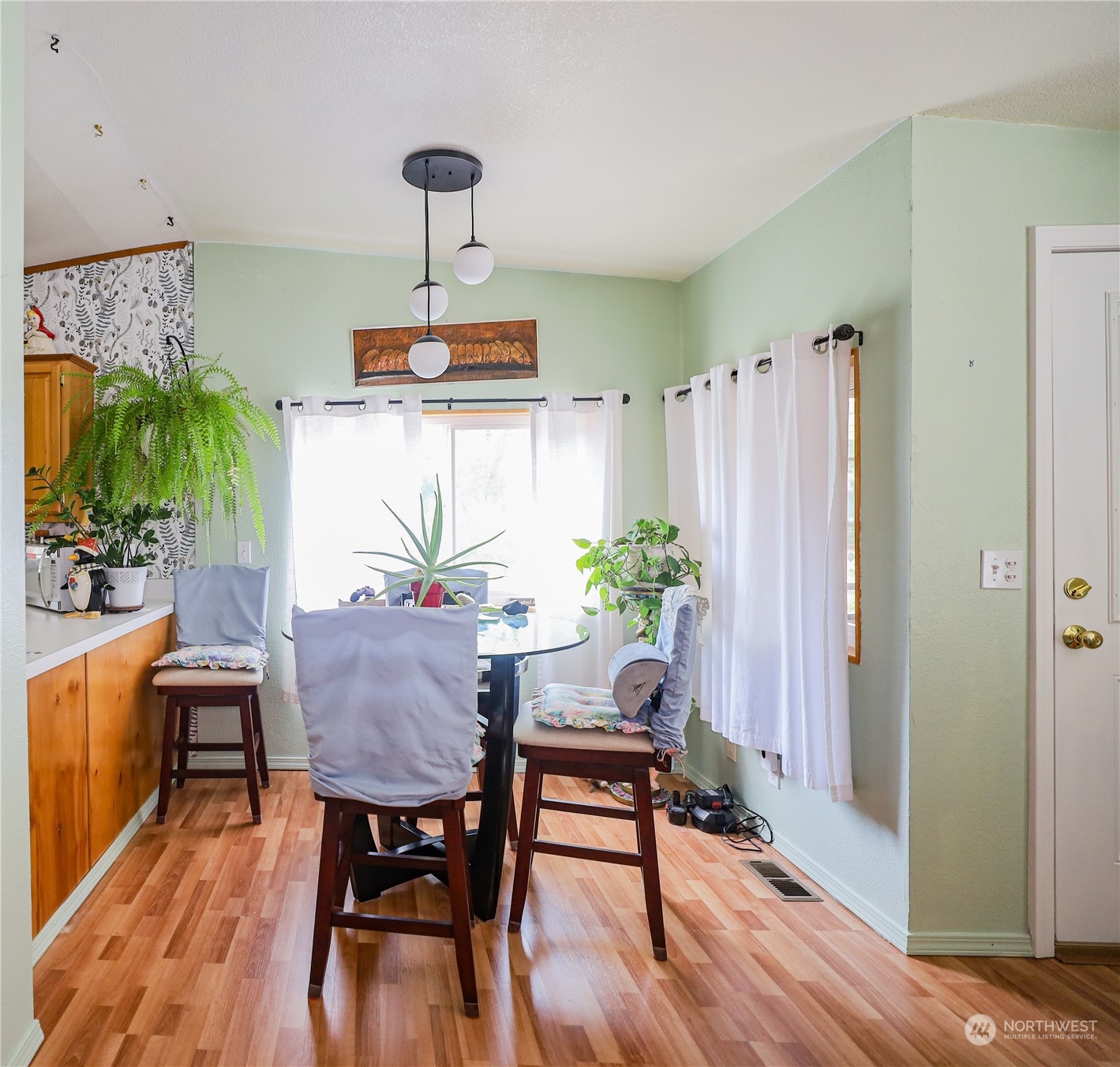 9 Poplar Road, Unit 33 Montesano, WA 98563 - Photo 7 of 18 a view of a dining room with furniture window and wooden floor