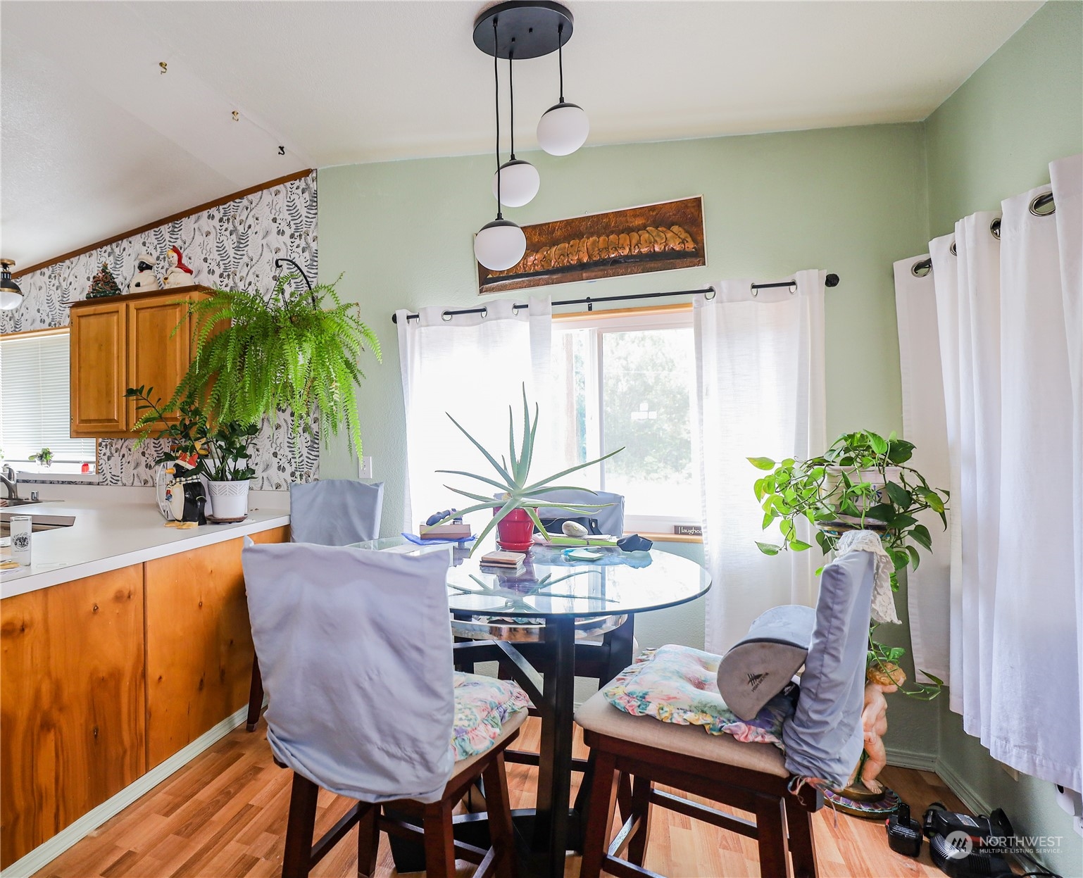 9 Poplar Road, Unit 33 Montesano, WA 98563 - Photo 8 of 18 a dining room with furniture and a potted plant