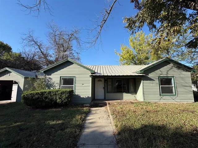 a house with trees in the background