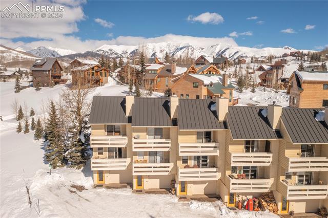 710 Gothic Road, Unit 1 Crested Butte, CO 81225 - Photo 5 of 25 Snowy aerial view with a mountain view