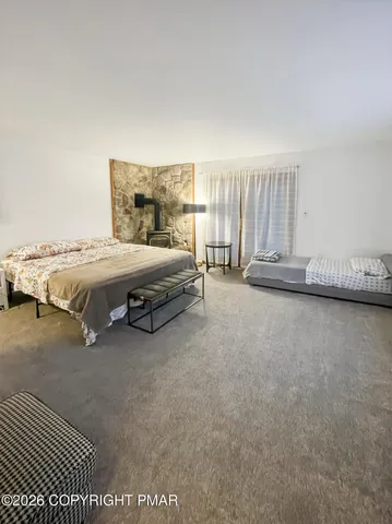 a bed room with a bed and a night stand