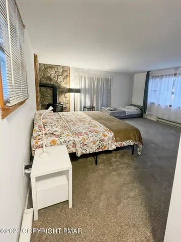 a bedroom with a bed and a dresser