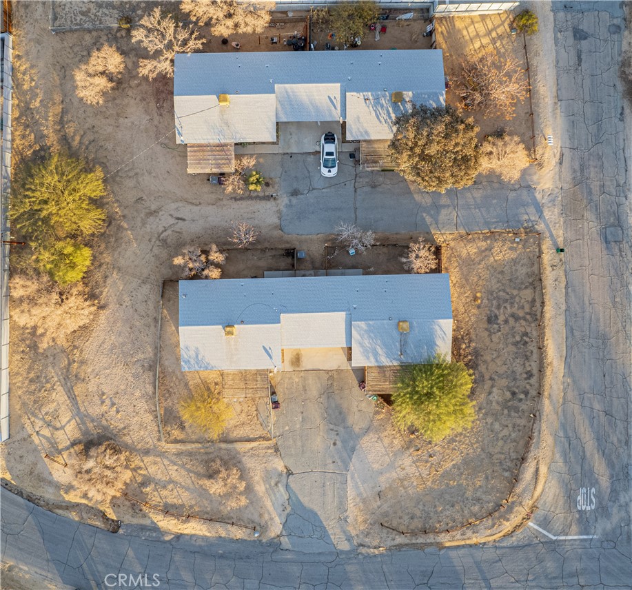 61464 Desert Air Road Joshua Tree, CA 92252 - Photo 10 of 12 an aerial view of a house with a yard
