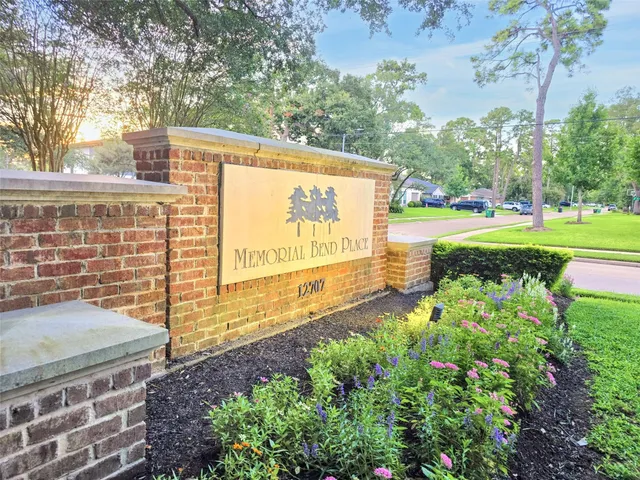 a view of a street with a building in the background