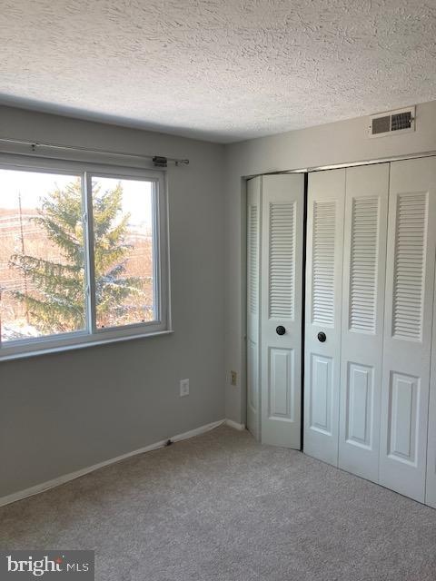 19609 Gunners Branch Road, Unit F Germantown, MD 20876 - Photo 14 of 18 a view of an empty room with a window