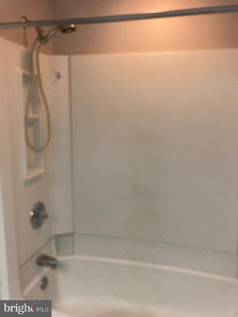 19609 Gunners Branch Road, Unit F Germantown, MD 20876 - Photo 16 of 18 a bathroom with a shower