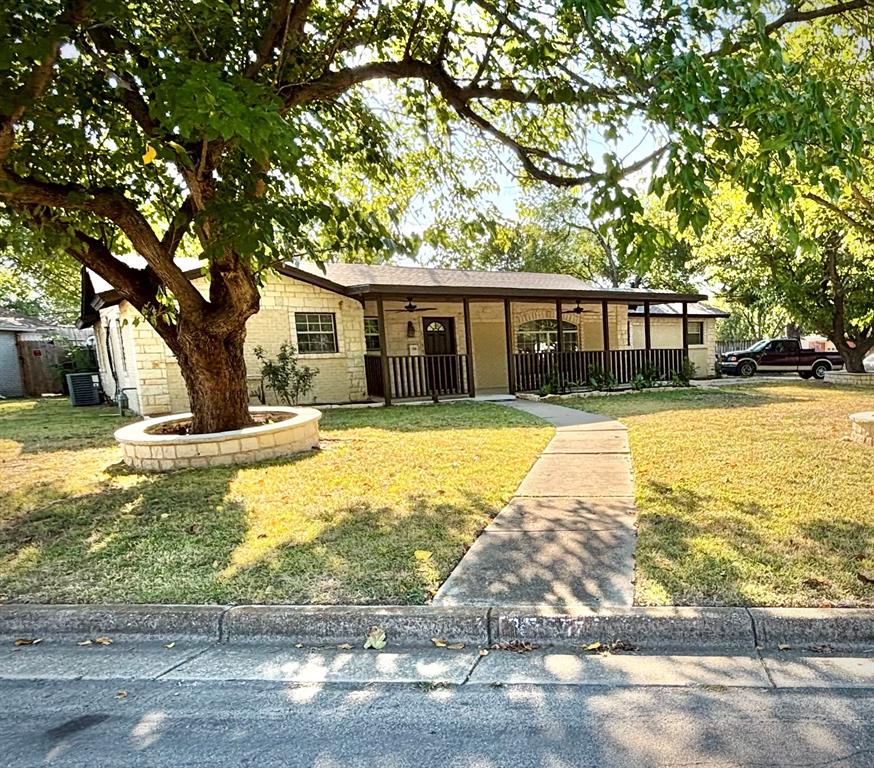 a swimming pool with trees in the background