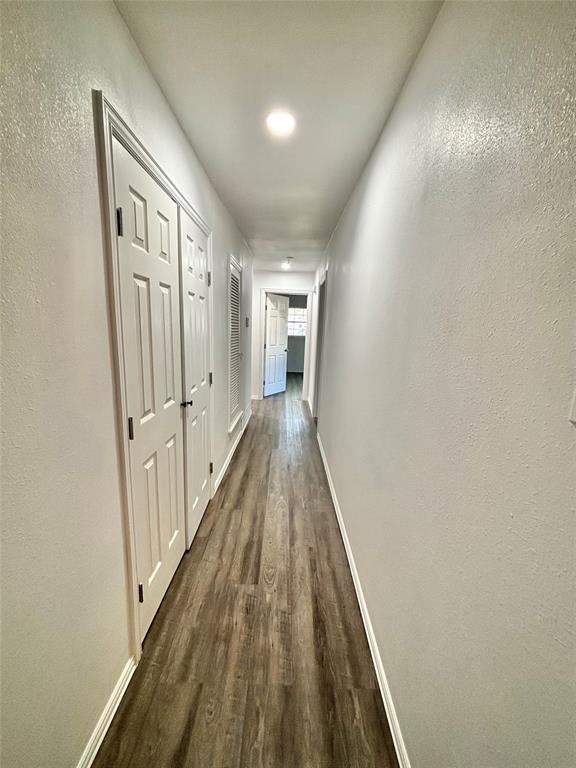3557 Reeves Street North Richland Hills, TX 76117 - Photo 12 of 34 a view of a hallway with wooden floor and staircase