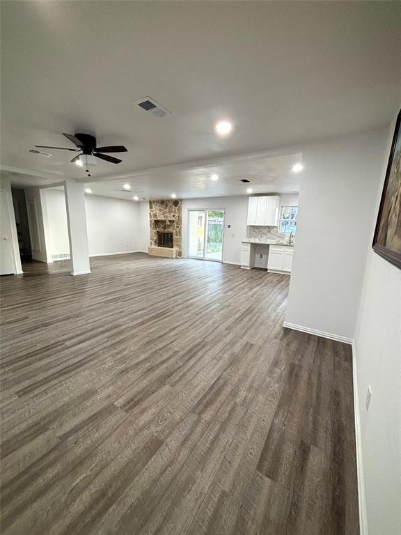 3557 Reeves Street North Richland Hills, TX 76117 - Photo 20 of 34 an empty room with wooden floor and kitchen view