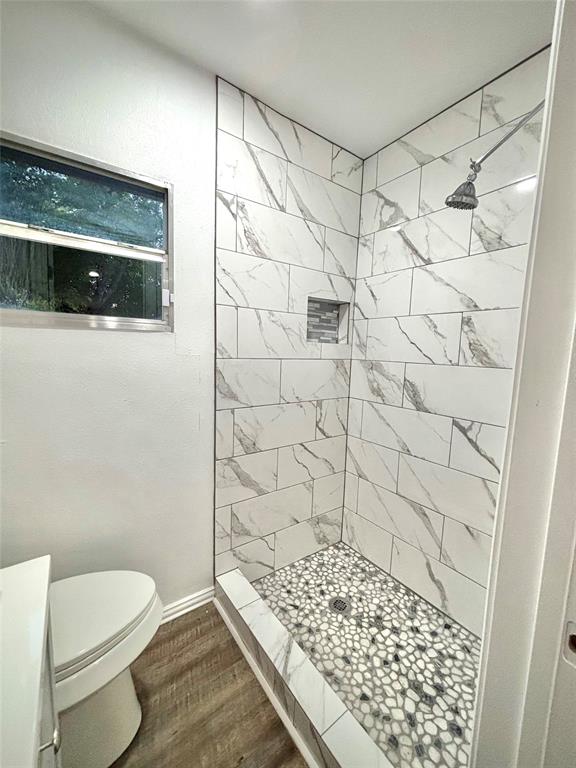 3557 Reeves Street North Richland Hills, TX 76117 - Photo 21 of 34 a bathroom with a shower and a toilet