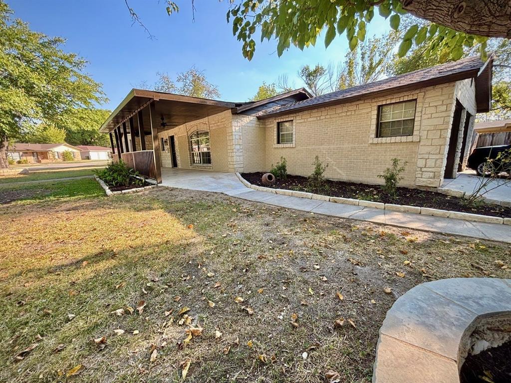 3557 Reeves Street North Richland Hills, TX 76117 - Photo 28 of 34 a view of a house with backyard and trees