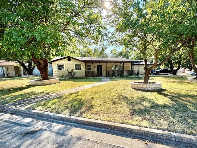 a view of swimming pool with outdoor seating and yard